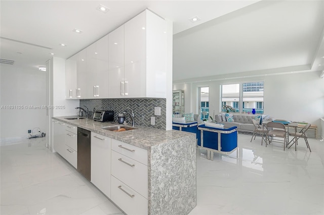 9511 Collins Ave Unit 1502, Surfside, FL 33154 - kitchen featuring modern cabinets, light marble finish floors, dishwasher, white cabinets, and decorative backsplash