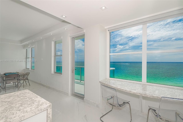 9511 Collins Ave Unit 1502, Surfside, FL 33154 - interior space featuring a water view, recessed lighting, light marble finish flooring, and light countertops