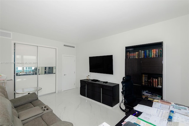 9511 Collins Ave Unit 1502, Surfside, FL 33154 - living area featuring marble tiled floors and an office area