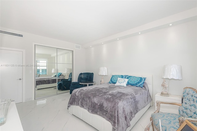 9511 Collins Ave Unit 1502, Surfside, FL 33154 - bedroom featuring a closet, recessed lighting, and marble finish flooring