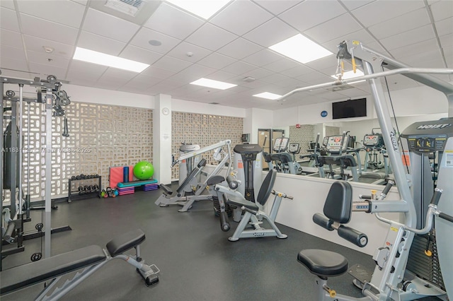 9511 Collins Ave Unit 1502, Surfside, FL 33154 - exercise room featuring a paneled ceiling