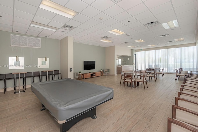 9511 Collins Ave Unit 1502, Surfside, FL 33154 - recreation room with light wood-style flooring, billiards, and a paneled ceiling
