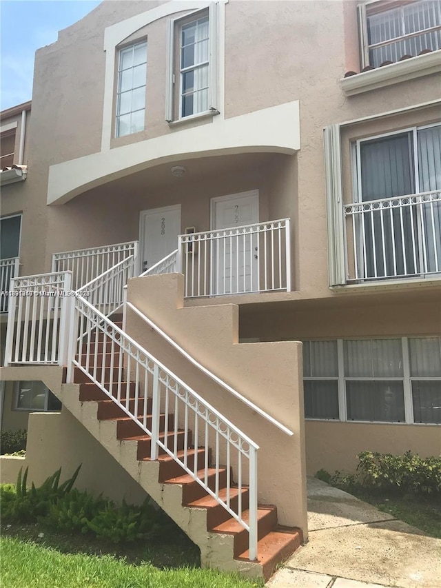 8670 NW 6th Ln Unit 4-208, Miami, FL 33126 - view of property featuring stairs