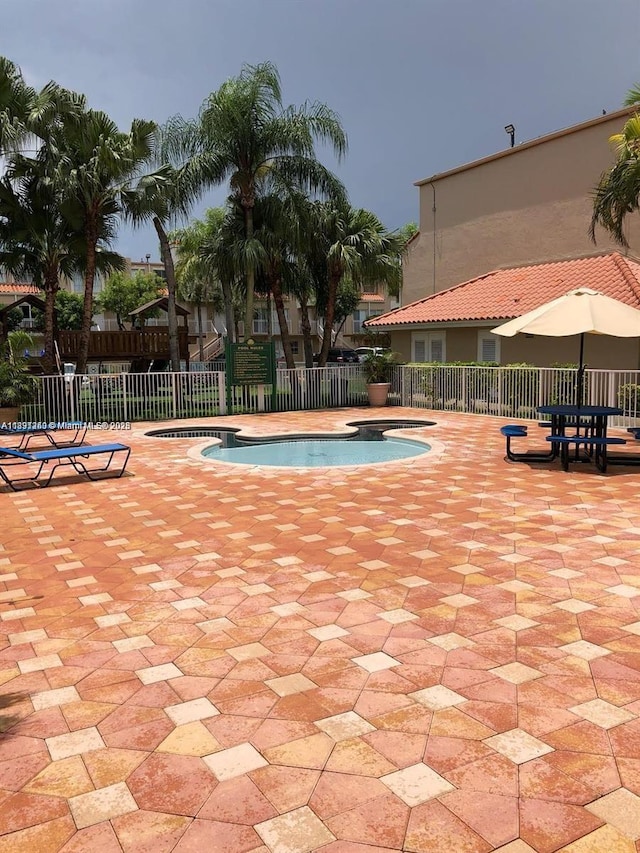 8670 NW 6th Ln Unit 4-208, Miami, FL 33126 - community pool with a patio area