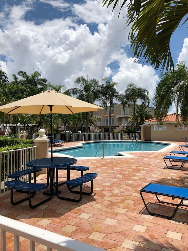 8670 NW 6th Ln Unit 4-208, Miami, FL 33126 - community pool featuring a patio