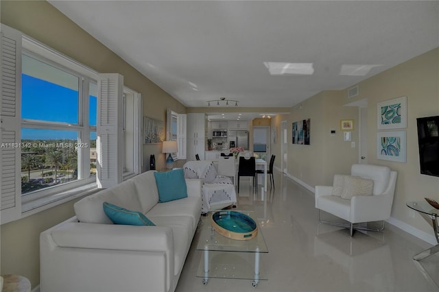 1620 N Ocean Blvd Unit 510, Pompano Beach, FL 33062 - living room featuring baseboards