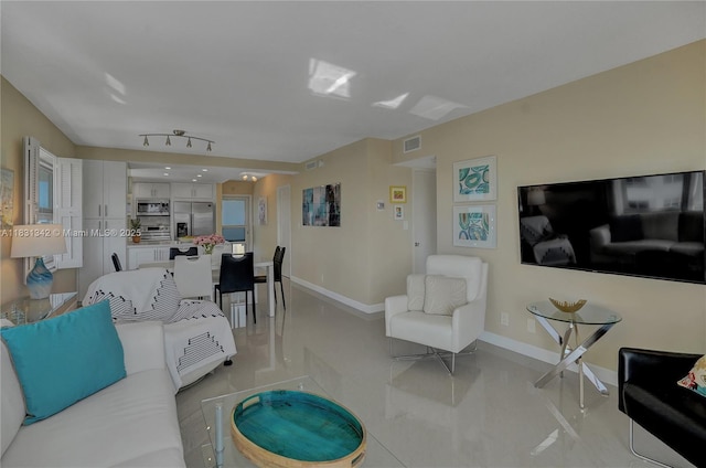 1620 N Ocean Blvd Unit 510, Pompano Beach, FL 33062 - living room with baseboards and light tile patterned floors