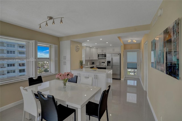 1620 N Ocean Blvd Unit 510, Pompano Beach, FL 33062 - dining space with light tile patterned flooring, a textured ceiling, and recessed lighting