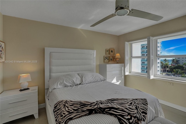 1620 N Ocean Blvd Unit 510, Pompano Beach, FL 33062 - bedroom featuring baseboards and a ceiling fan