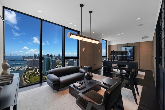 788 NE 23rd St Unit 5401, Miami, FL 33137 - living room with a wall of windows, a city view, and wood finished floors