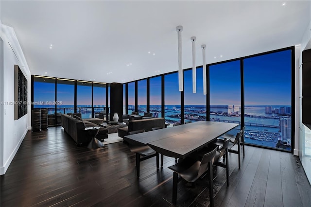 788 NE 23rd St Unit 5401, Miami, FL 33137 - dining area featuring a wall of windows, a water view, and hardwood / wood-style flooring