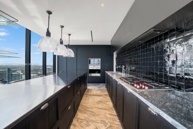 788 NE 23rd St Unit 5401, Miami, FL 33137 - kitchen with appliances with stainless steel finishes, decorative backsplash, decorative light fixtures, and dark cabinets