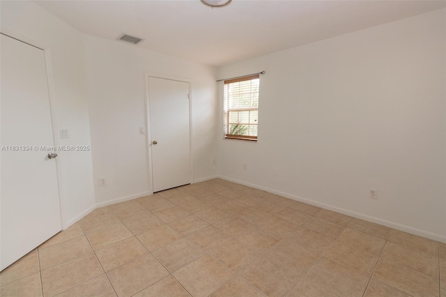 18328 NW 68th Ave Unit P, Hialeah, FL 33015 - empty room with light tile patterned floors