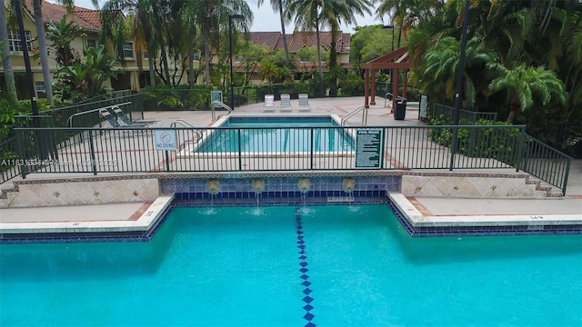 18328 NW 68th Ave Unit P, Hialeah, FL 33015 - community pool with a patio area