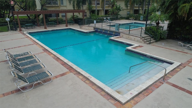 18328 NW 68th Ave Unit P, Hialeah, FL 33015 - community pool with a patio