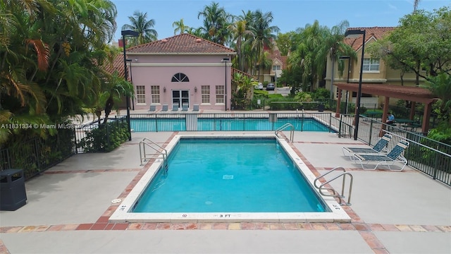 18328 NW 68th Ave Unit P, Hialeah, FL 33015 - community pool featuring a patio area