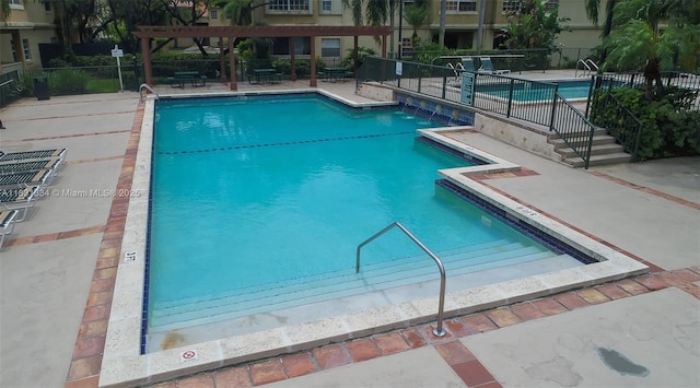 18328 NW 68th Ave Unit P, Hialeah, FL 33015 - community pool with a pergola and a patio area