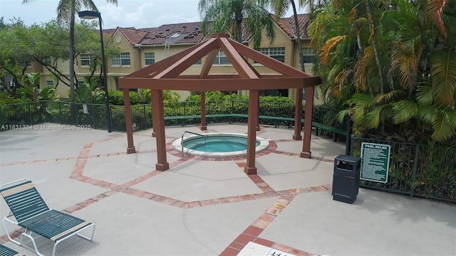18328 NW 68th Ave Unit P, Hialeah, FL 33015 - view of patio with a hot tub and a gazebo