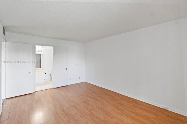 300 SW 134th Way Unit 413E, Pembroke Pines, FL 33027 - empty room with light wood-type flooring and baseboards