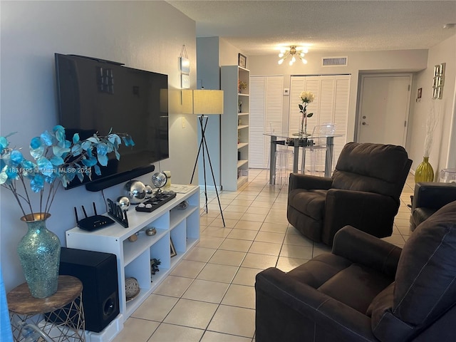 8251 NW 8th St Unit 214, Miami, FL 33126 - living room with light tile patterned floors and a textured ceiling