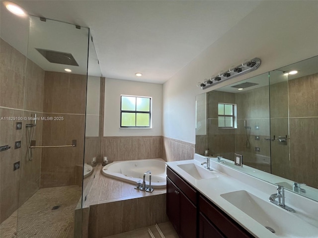 738 SE 37th Pl, Homestead, FL 33033 - bathroom featuring a shower stall, a jetted tub, and double vanity