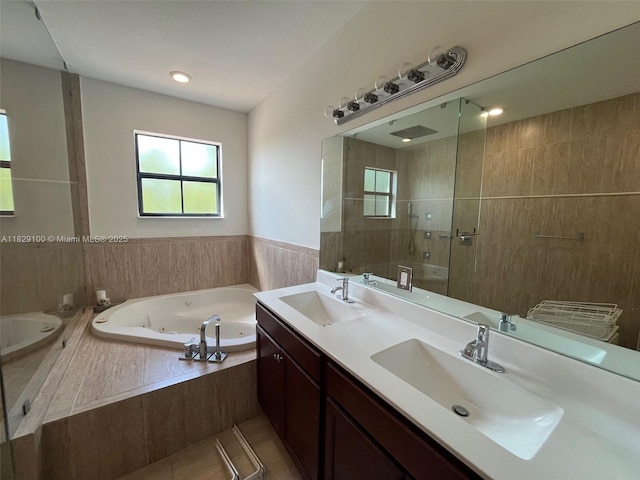 738 SE 37th Pl, Homestead, FL 33033 - bathroom featuring double vanity, a tub with jets, and a walk in shower