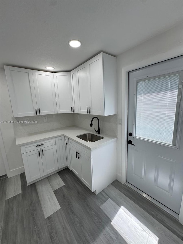 1794 NW 74th Ter, Miami, FL 33147 - kitchen with white cabinetry, light countertops, dark wood-style floors, and recessed lighting