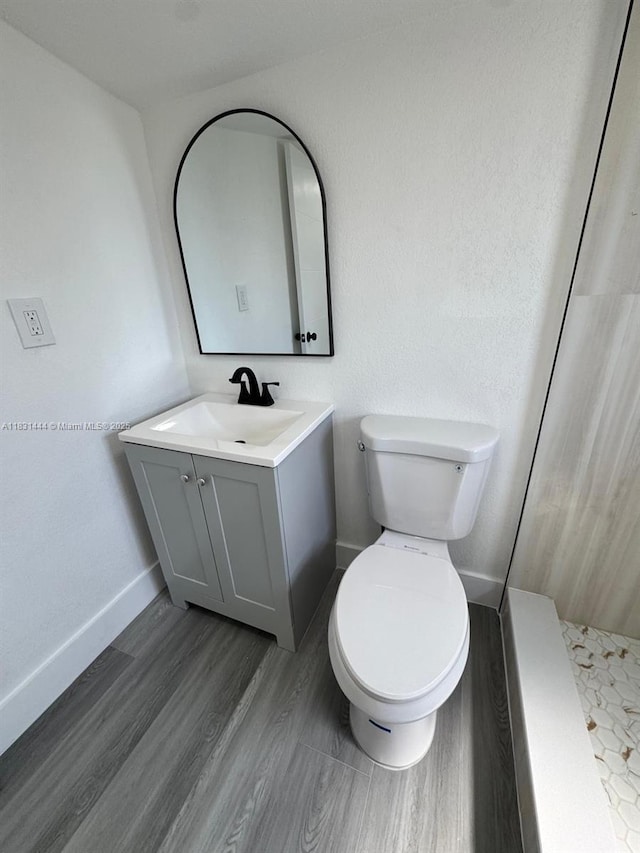 1794 NW 74th Ter, Miami, FL 33147 - bathroom with vanity, a tile shower, and wood finished floors