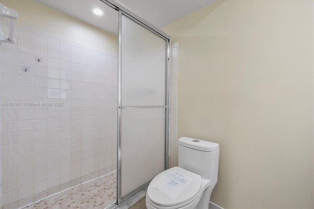 219 NE 14th Ave Unit 101, Hallandale Beach, FL 33009 - full bathroom featuring a stall shower and recessed lighting