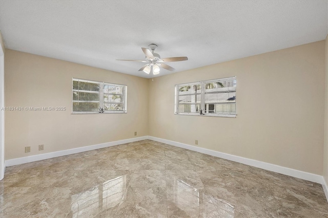 219 NE 14th Ave Unit 101, Hallandale Beach, FL 33009 - unfurnished room with plenty of natural light and a ceiling fan