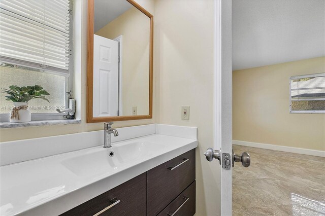 219 NE 14th Ave Unit 101, Hallandale Beach, FL 33009 - bathroom with vanity and baseboards