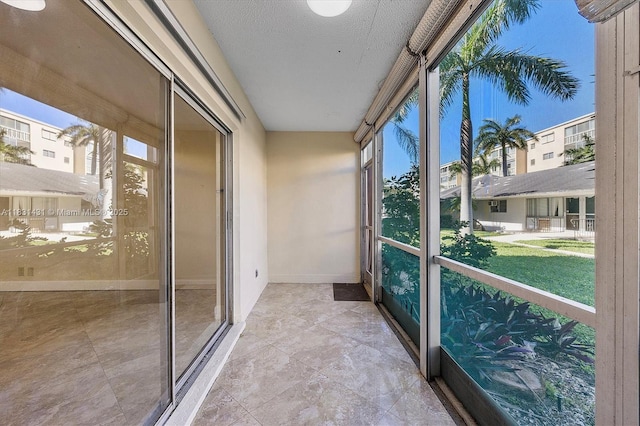 219 NE 14th Ave Unit 101, Hallandale Beach, FL 33009 - unfurnished sunroom with healthy amount of natural light