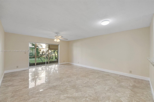 219 NE 14th Ave Unit 101, Hallandale Beach, FL 33009 - empty room with ceiling fan and baseboards