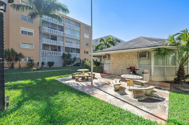 219 NE 14th Ave Unit 101, Hallandale Beach, FL 33009 - view of patio / terrace with an AC wall unit