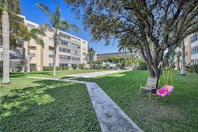 219 NE 14th Ave Unit 101, Hallandale Beach, FL 33009 - view of home's community featuring a lawn