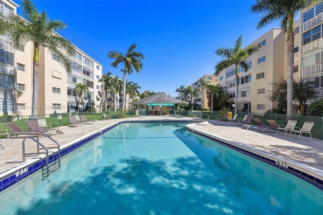 219 NE 14th Ave Unit 101, Hallandale Beach, FL 33009 - community pool featuring a patio