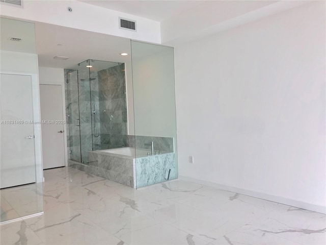 480 NE 31st St Unit 705, Miami, FL 33137 - bathroom with marble tiled floors, a bath, a marble finish shower, and recessed lighting