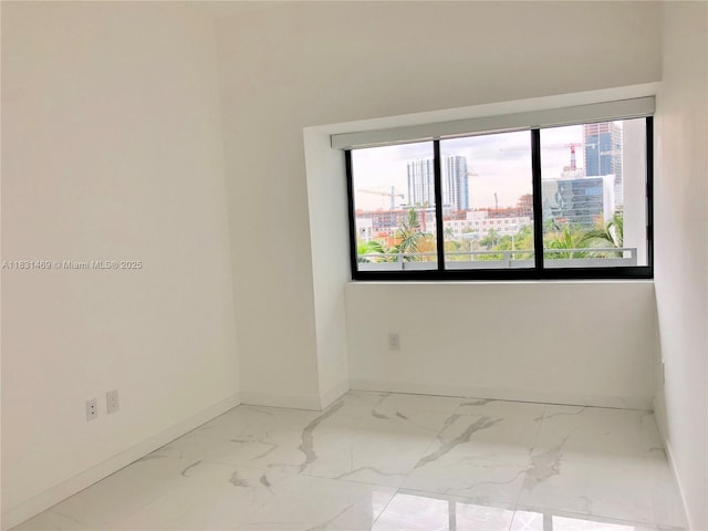 480 NE 31st St Unit 705, Miami, FL 33137 - spare room featuring marble finish flooring and a city view