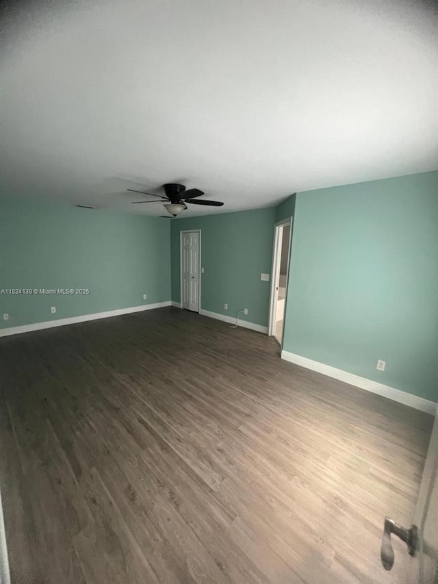 1305 SW 22, Cape Coral, FL 33991 - spare room featuring dark wood finished floors and a ceiling fan