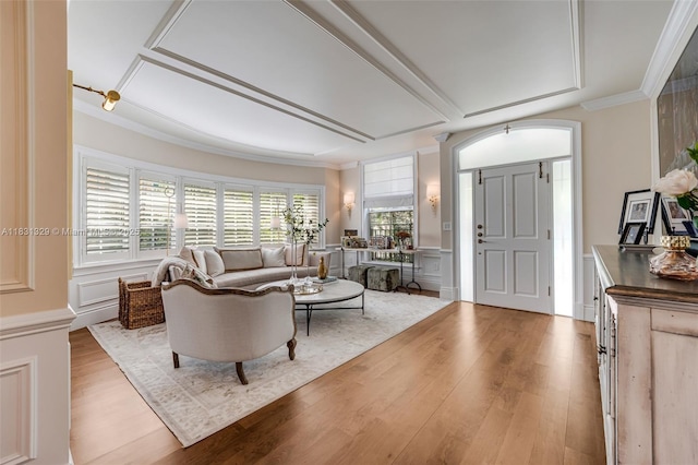618 Valencia Ave Unit 101, Coral Gables, FL 33134 - living room with a decorative wall, wood finished floors, crown molding, and a wainscoted wall
