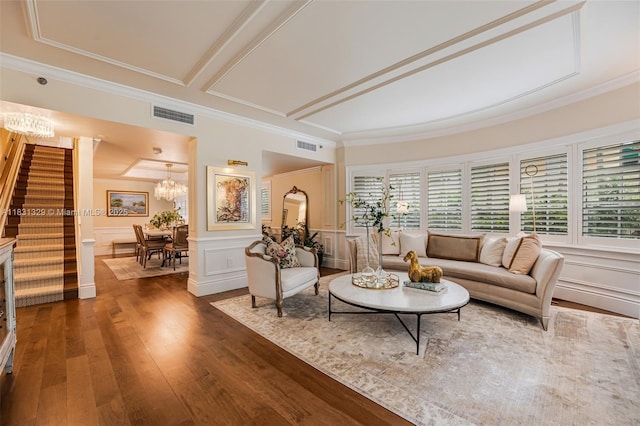 618 Valencia Ave Unit 101, Coral Gables, FL 33134 - living area with stairs, hardwood / wood-style flooring, a decorative wall, a chandelier, and crown molding