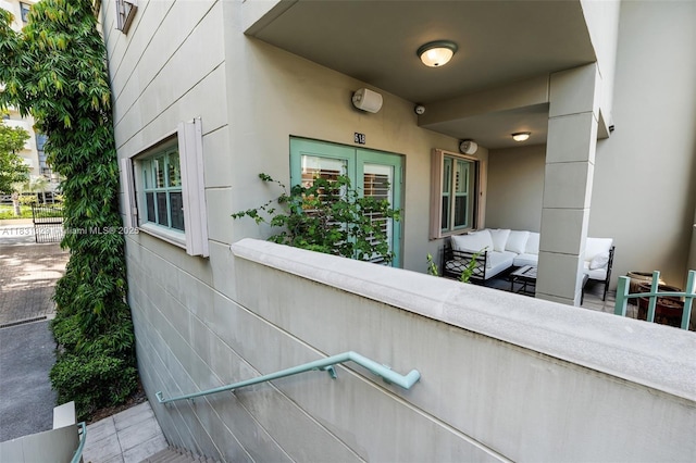 618 Valencia Ave Unit 101, Coral Gables, FL 33134 - view of exterior entry with outdoor lounge area and stucco siding