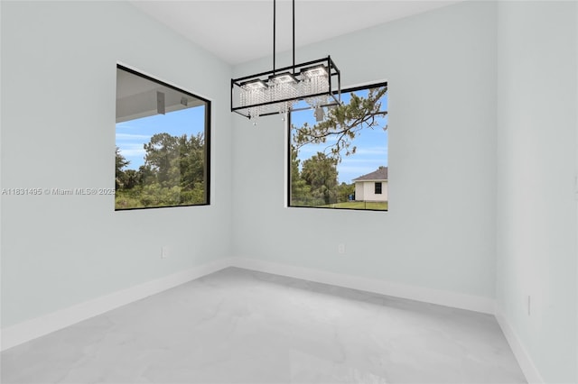 3209 45th St SW, Lehigh Acres, FL 33976 - unfurnished dining area featuring a chandelier, healthy amount of natural light, and marble finish flooring