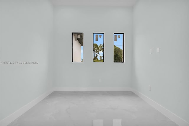 3209 45th St SW, Lehigh Acres, FL 33976 - spare room with baseboards and light marble finish floors