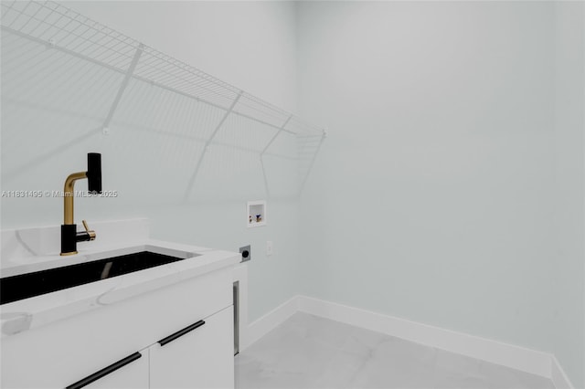 3209 45th St SW, Lehigh Acres, FL 33976 - laundry room featuring electric dryer hookup, cabinet space, washer hookup, and light marble finish flooring