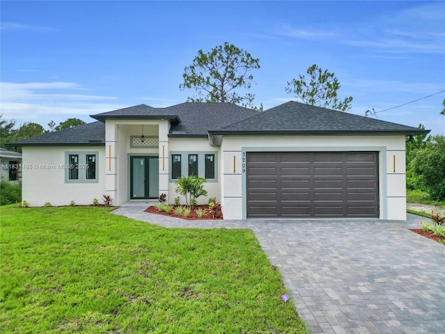 3209 45th St SW, Lehigh Acres, FL 33976 - view of front of property featuring stucco siding, a front lawn, roof with shingles, and a garage