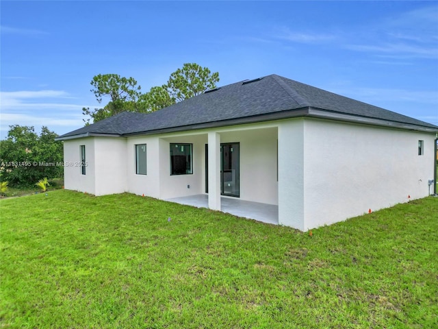 3209 45th St SW, Lehigh Acres, FL 33976 - rear view of property with a patio area, stucco siding, a yard, and roof with shingles