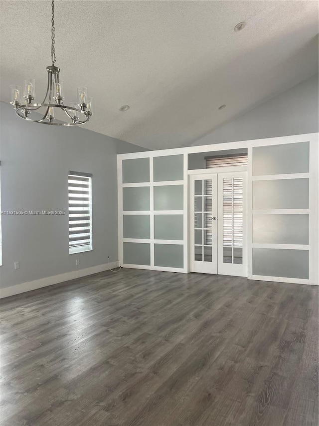 11123 SW 156th Ct, Miami, FL 33196 - spare room with a chandelier, lofted ceiling, a textured ceiling, dark wood-style flooring, and built in shelves