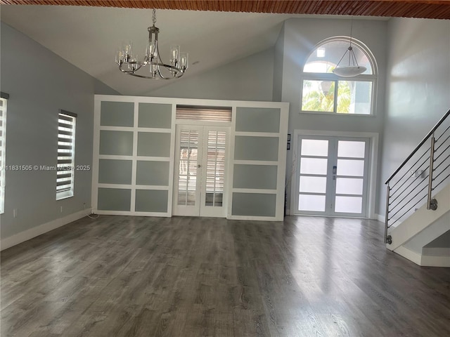 11123 SW 156th Ct, Miami, FL 33196 - unfurnished living room featuring french doors, a chandelier, stairway, dark wood-type flooring, and high vaulted ceiling