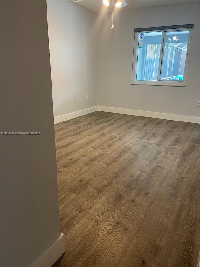 11123 SW 156th Ct, Miami, FL 33196 - spare room featuring dark wood-type flooring and a ceiling fan